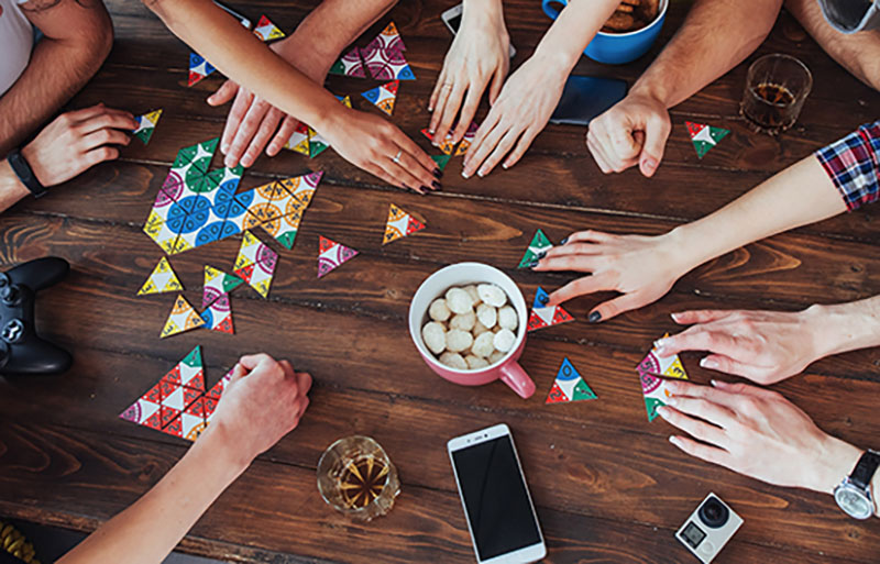 drinks, snacks and friends about a table